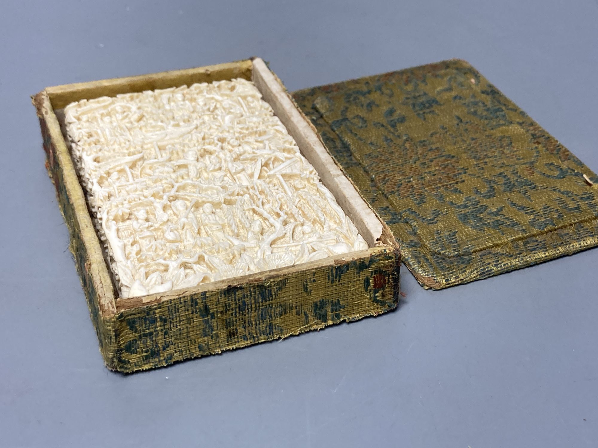 A 19th century Chinese export ivory case, in original brocade covered case stamped 'Luenchun', 11 x 7cm